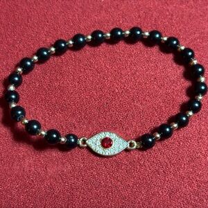 Black Beaded Bracelet with Red Evil Eye Charm NWOT